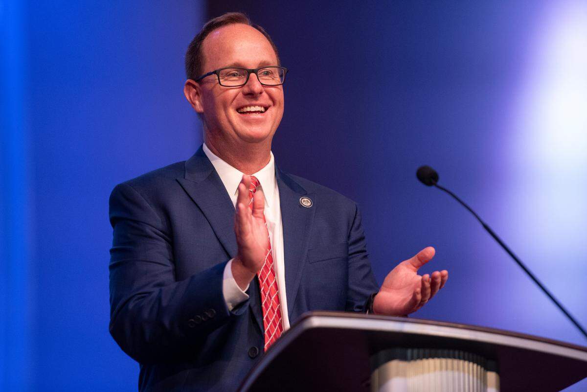 District Attorney Crosby Parker applauds a musical act during a candlelight ceremony as a part of National Crime Victims’ Rights Week at First Baptist Church of Gulfport on Tuesday, April 23, 2024.