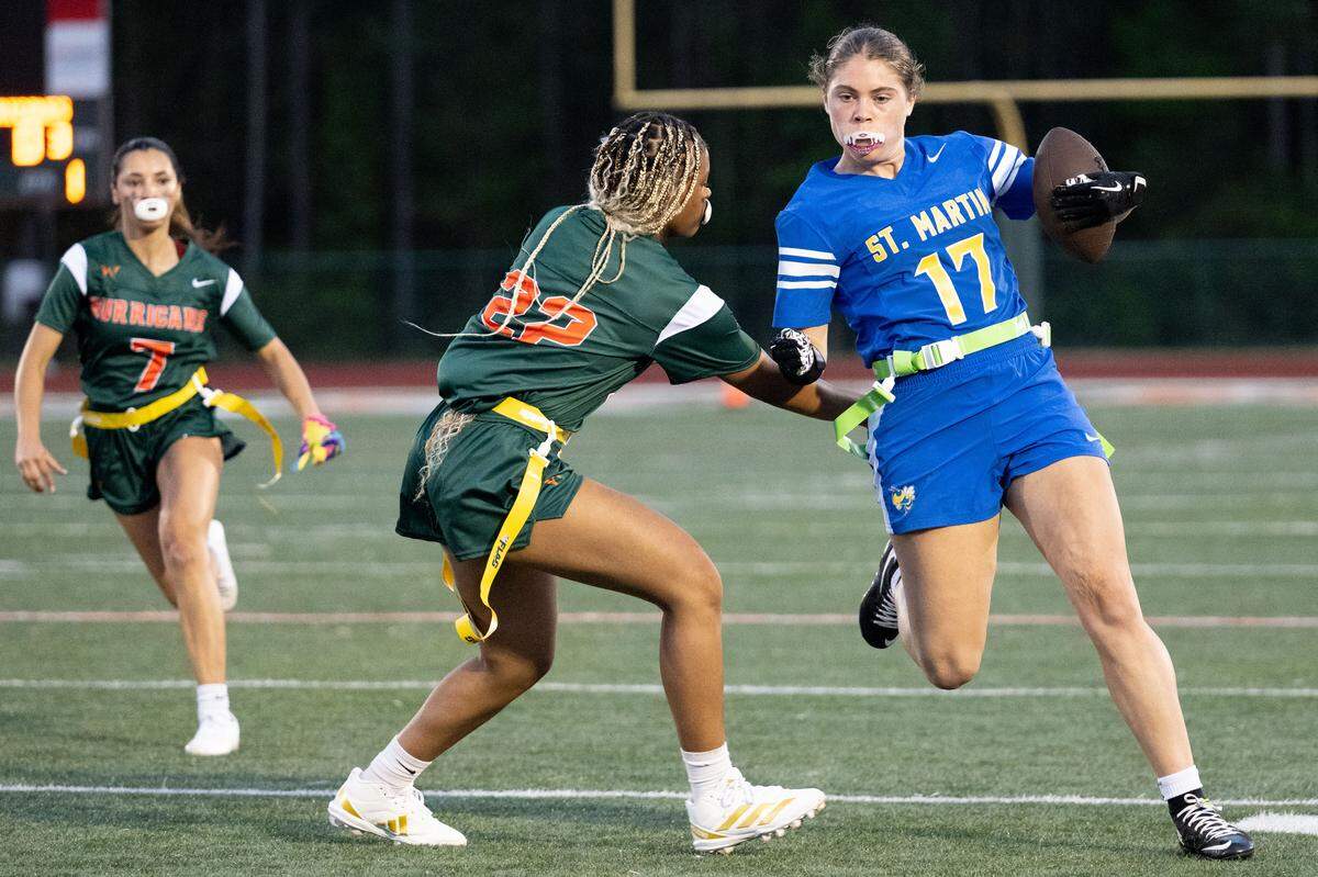 St. Martin’s Brianne Sanders (17) runs with the ball during a flag football game at West Harrison High School on Thursday, April 2, 2026.