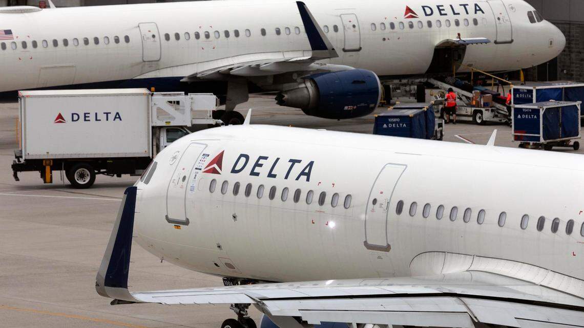 An unruly Delta Air Lines passenger cut his own neck and then attacked a crew member on board a flight to New Orleans, Louisiana, deputies say. (AP Photo/Michael Dwyer)