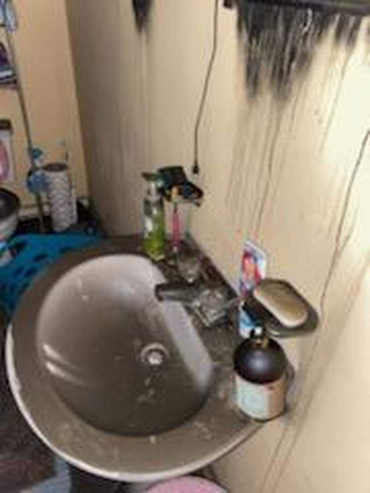 The bathroom of an apartment unit at Rodenberg Apartments in Biloxi after a fire on Nov. 15, 2021.