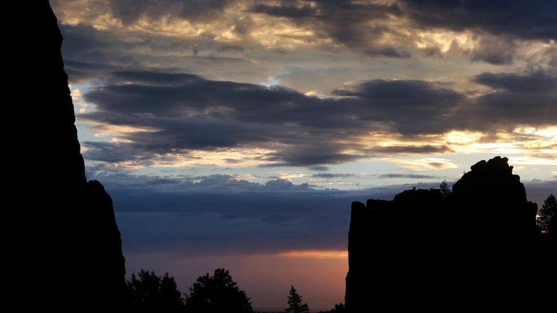 The sun rises behind the sheer rock faces at the mouth of Eldorado Canyon State Park, a place for technical rock climbers and also a popular retreat for local tourists, just outside Boulder, Colo. A climber was seriously injured and had to be rescued after falling on March 26. (AP Photo/Brennan Linsley)