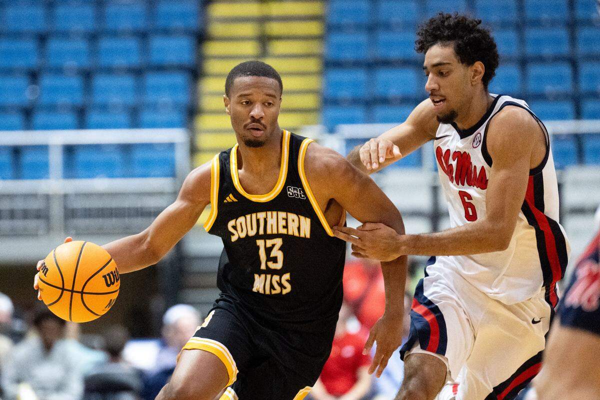 Southern Mississippi guard Dylan Brumfield (13) drives to the basket.