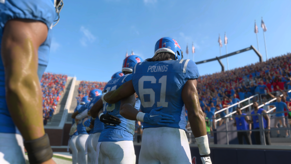 A screengrab from EA College Football 25 shows Ole Miss players interacting with the fans for the alma mater after a win.