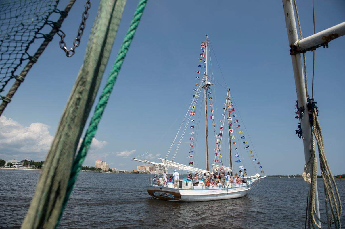 A boat decorated with flags during the Blessing of the Fleet in Biloxi on Sunday, May 28, 2023.