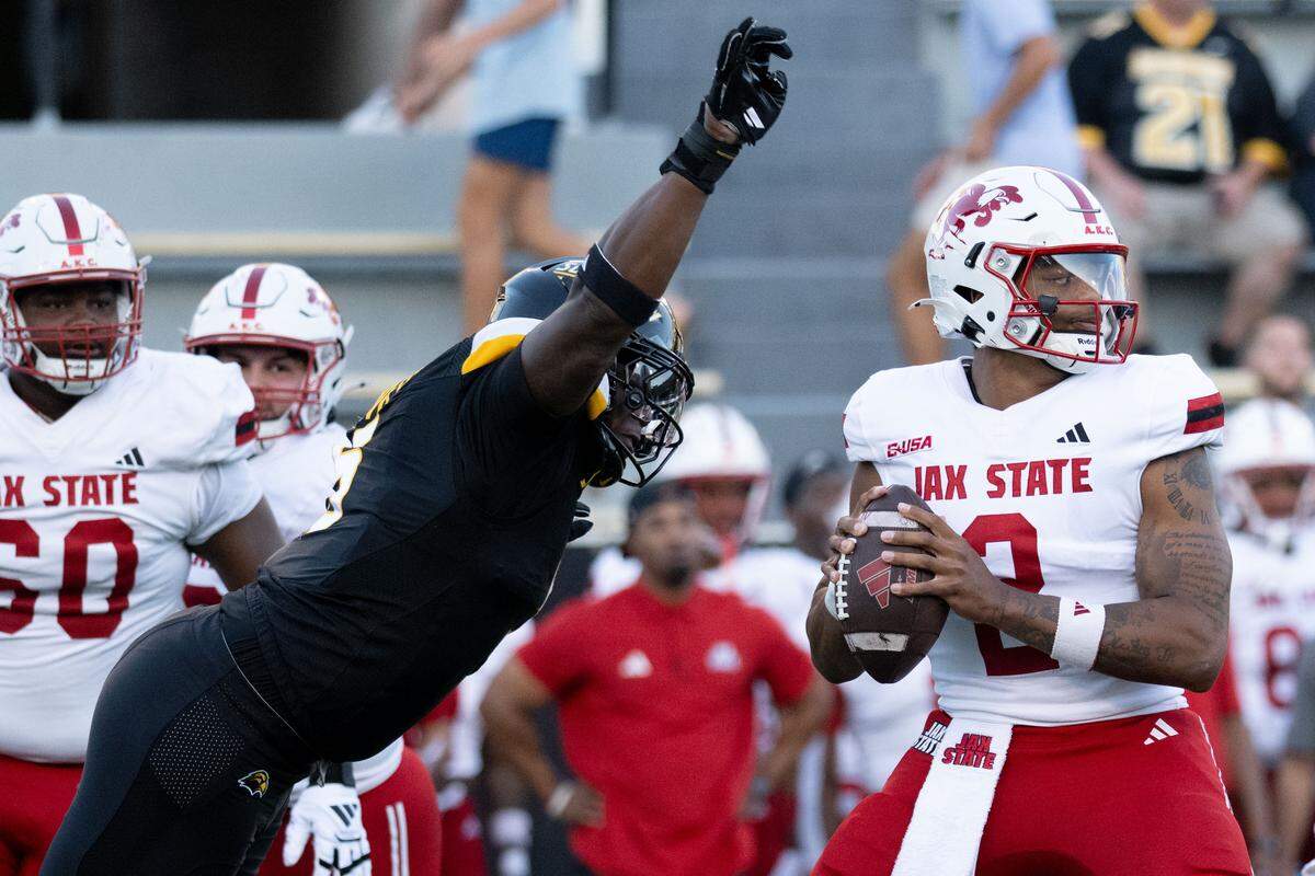 Southern Miss defensive lineman JJ Hawkins (5) leaps forward to strips-ack Jacksonville State quarterback Gavin Wimsatt (2).