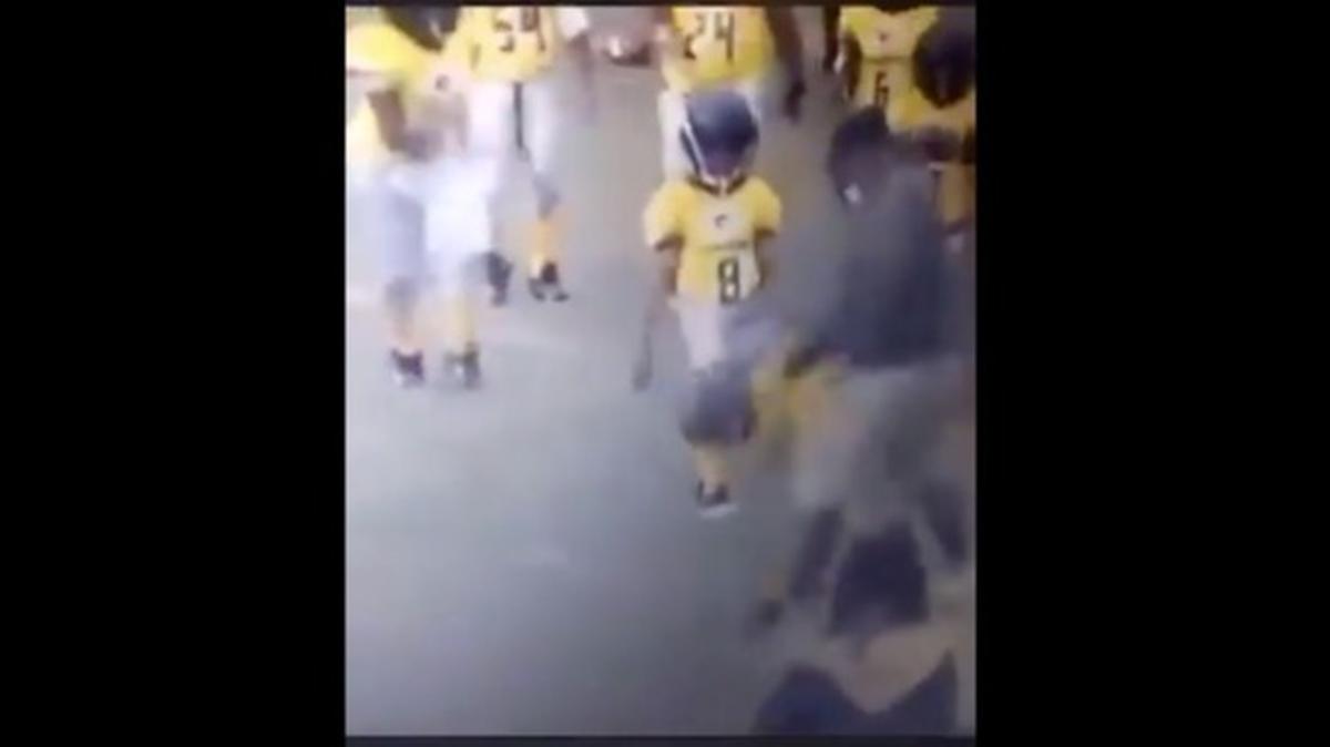 Police in Savannah, Georgia say an investigation is underway after an online video showed a youth football coach striking a player during an away game in Florida.