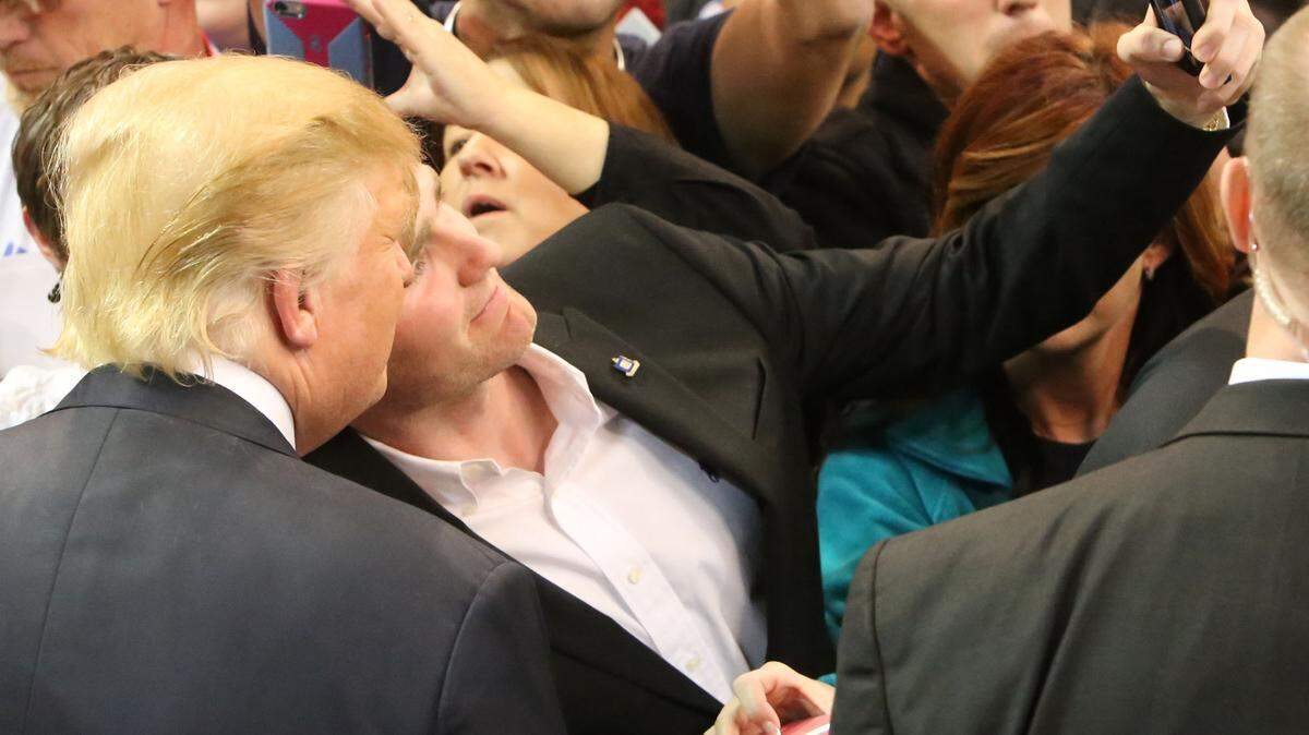JOHN FITZHUGH/SUN HERALDA Donald Trump supporter takes a selfie with the Republican presidential candidate at his rally at the Mississippi Coast Coliseum in Biloxi on Saturday Jan. 2, 2015.