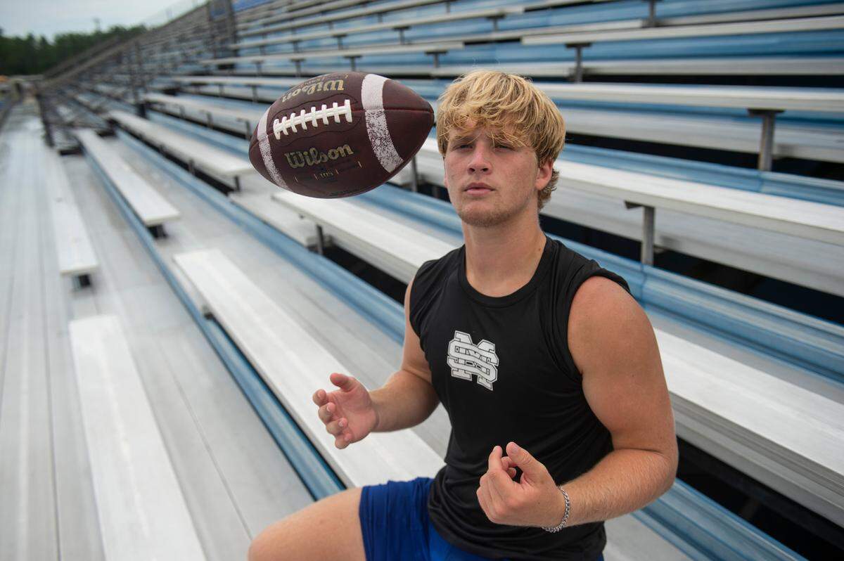 Gavin Allen, a linebacker for the St. Martin football team, poses for a portrait in the stands at Joe Barlow Stadium on Wednesday, July 13, 2022.