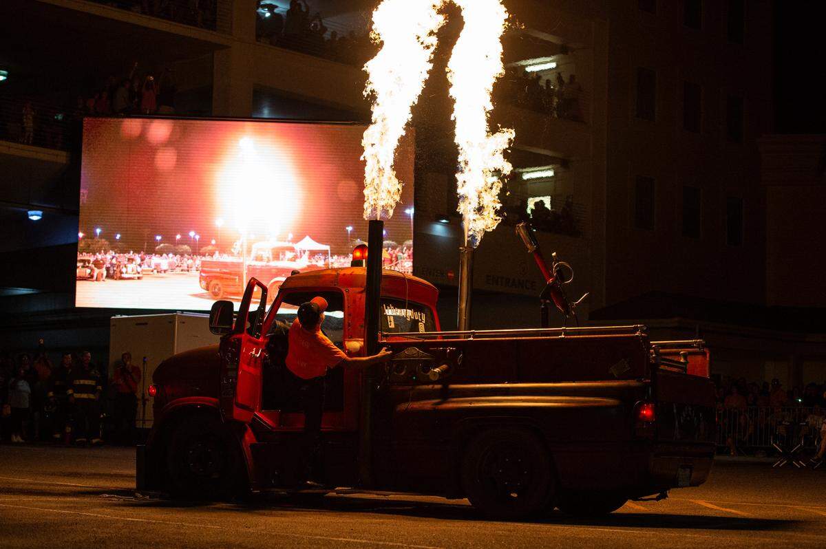 JR McMurray watches as his 1969 Ford N600 produces two large columns of flame during a flame throwing competition, where drivers compete to see which car can produce the biggest flames, at Island View Casino in Gulfport during Cruisin’ The Coast on Tuesday, Oct. 5, 2021.
