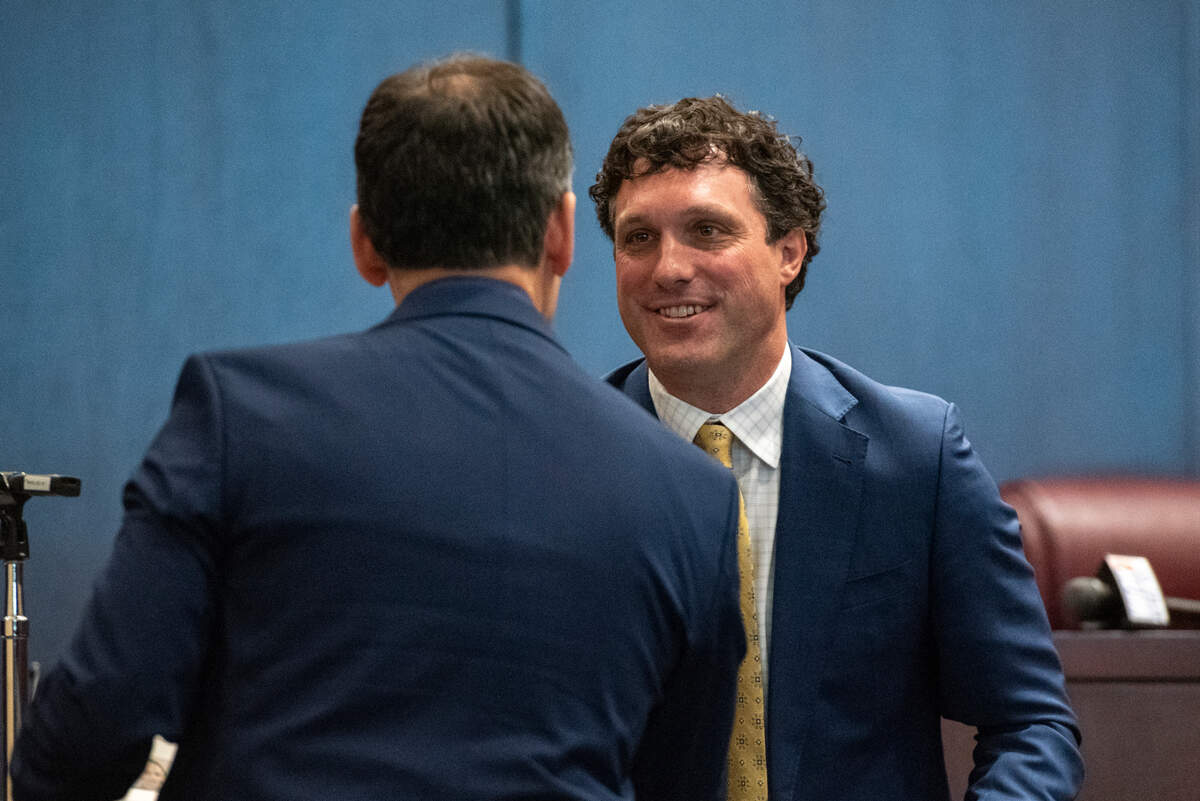 U.S. District Judge Taylor McNeel shakes the hands of all the newly naturalized citizens during a naturalization ceremony at Dan M. Russell Courthouse in Gulfport on Thursday, Oct. 19, 2023.