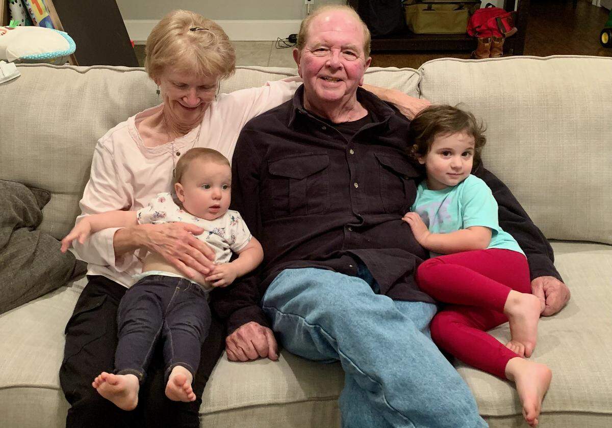 Fay and Peter Barrett of Gulfport enjoy two of their grandchildren. Peter Barrett passed away Friday after a storied legal career that spanned more than 50 years.