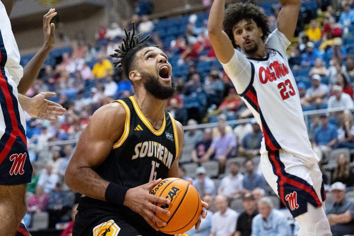 Southern Mississippi forward Djahi Binet (15) looks up as he prepares to take a shot.
