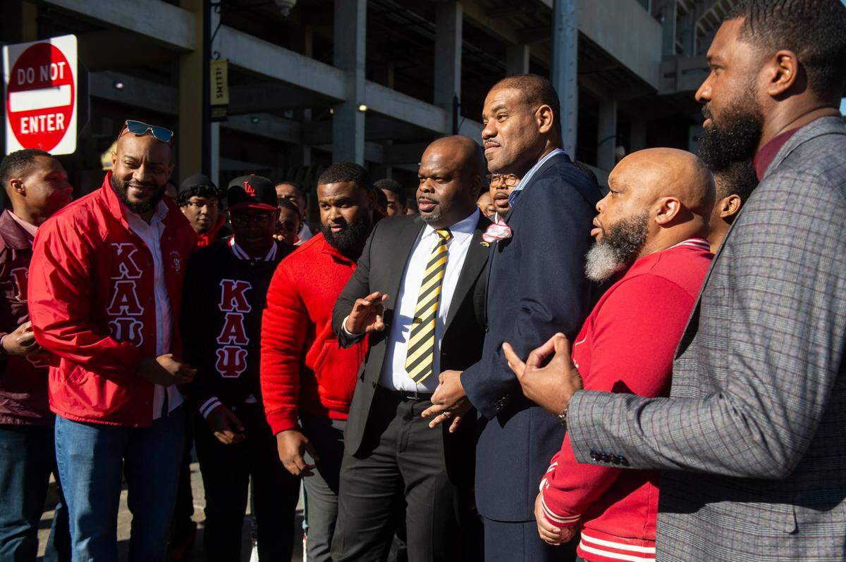 Members of Kappa Alpha Psi pose with Southern Miss’ new head football coach Charles Huff during a public welcome celebration for Huff at The Rock in Hattiesburg on Thursday, Dec. 12, 2024.