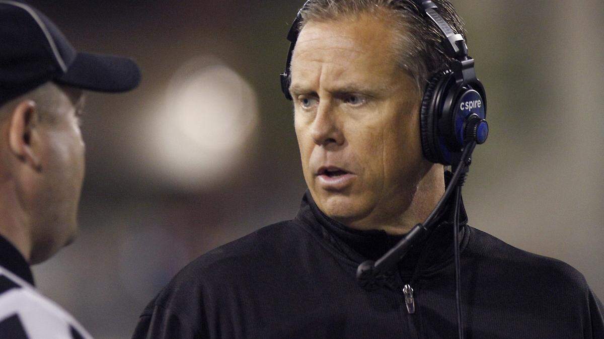 TIM ISBELL/SUN HERALD 
 Southern Miss coach Todd Monken talks to the referee during a break in action against North Texas on Oct. 3.