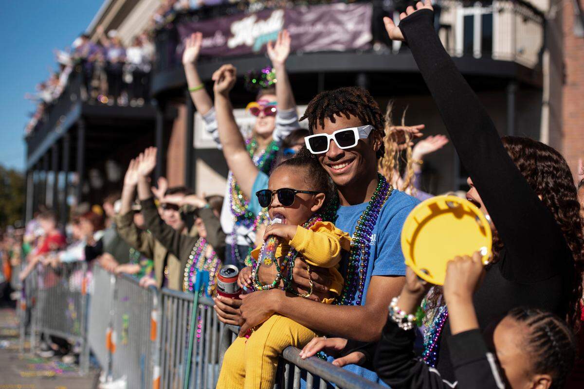 Paradegoers during the Gulf Coast Carnival Association’s Mardi Gras parade in Biloxi on Tuesday, Feb. 13, 2024.