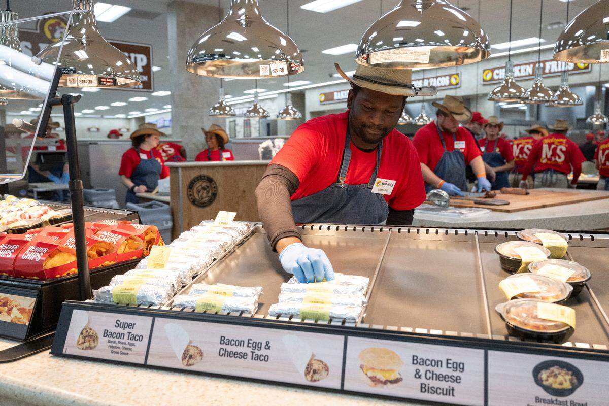 Workers stock hot food before the opening of Buc-ee’s first Mississippi location, located in Harrison County, on Monday, June 9, 2025.