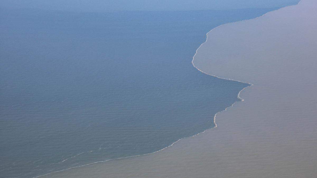 Murky, sediment-rich Mississippi River water mixes with saltwater in the Gulf of Mexico off the coast of Louisiana on June 7. The Mississippi River carries nutrient runoff from 41% of the United States to the gulf.