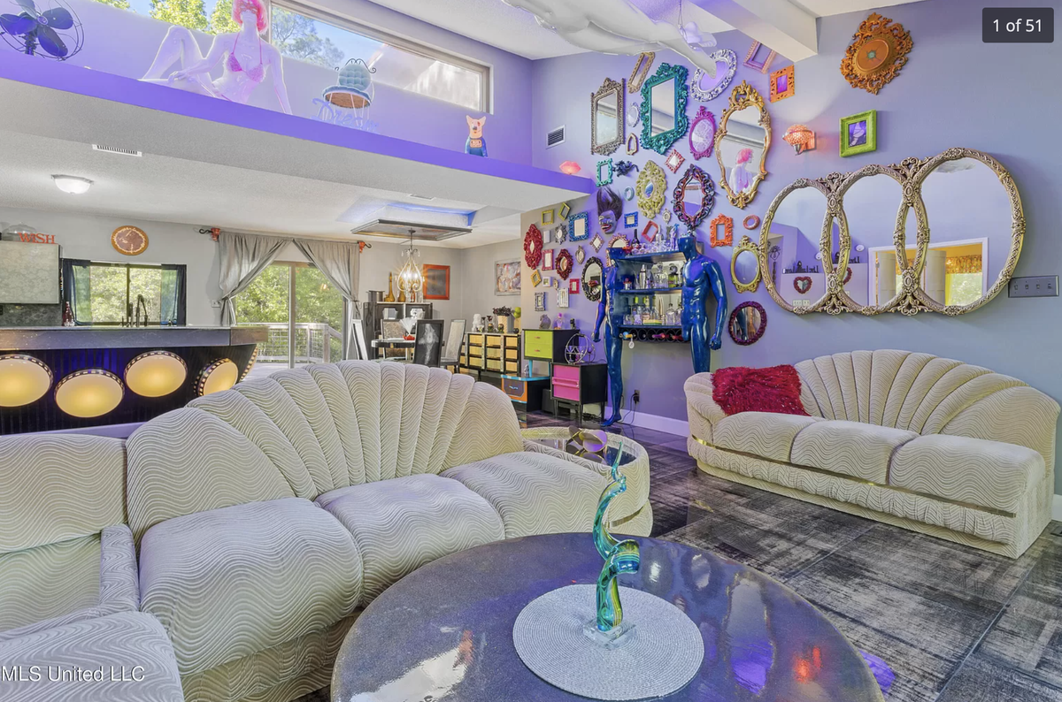 A home for sale on Graveline Road in Gautier has purple and orange walls, mirrors and mannequins throughout.