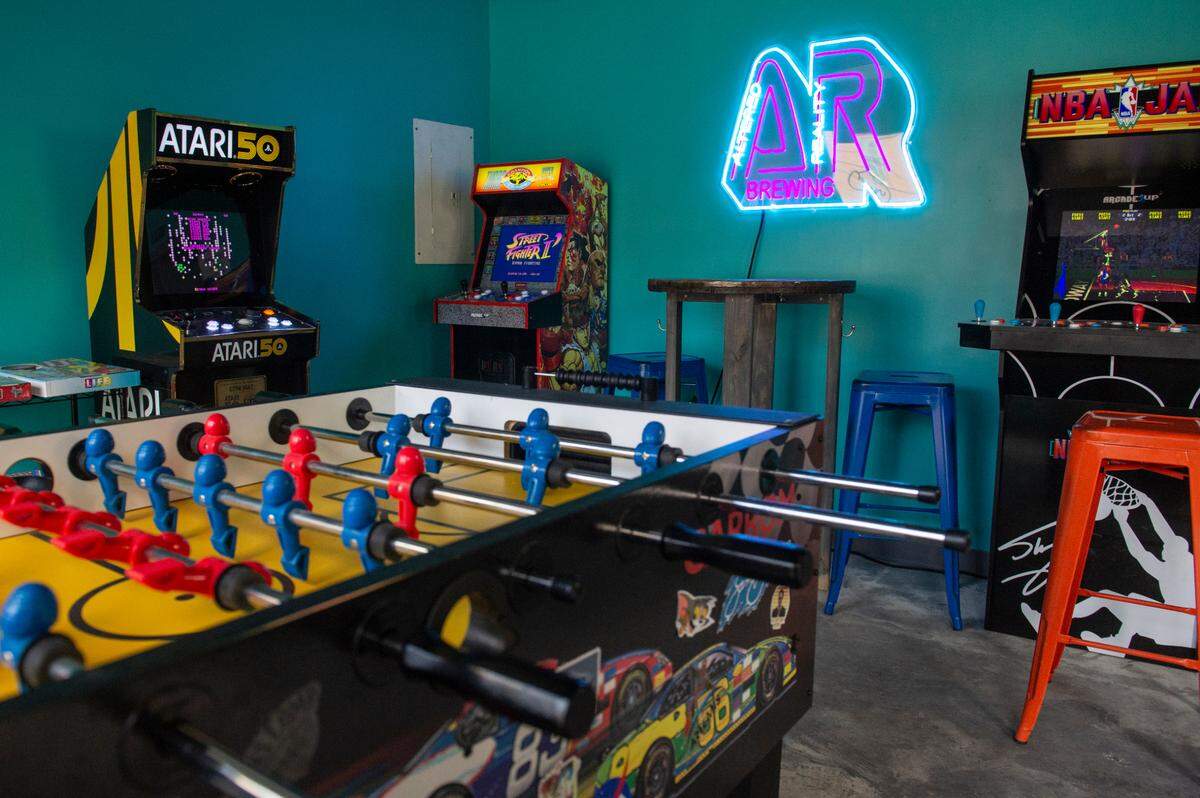 A game room and arcade inside Altered Reality Brewing on Howard Avenue in Biloxi will be a hit with families.
