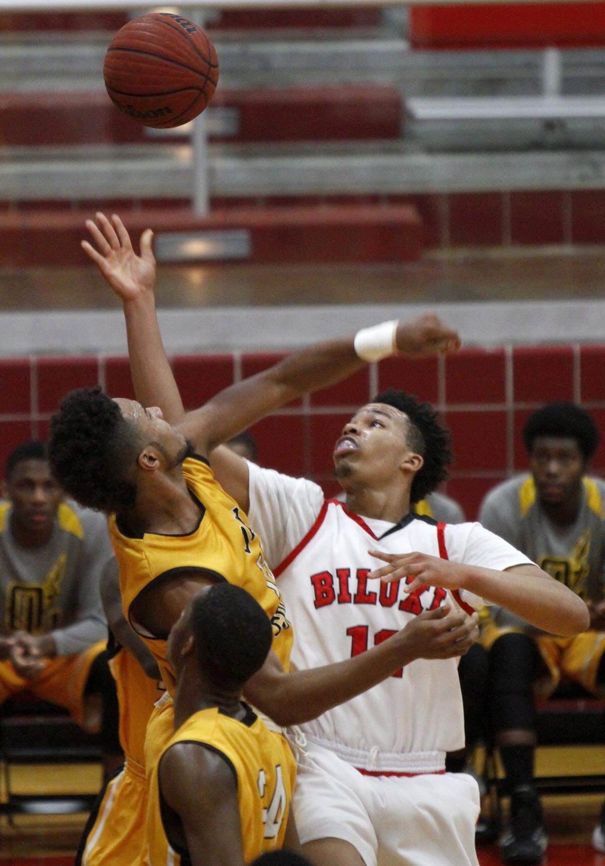 TIM ISBELL/SUN HERALD  Biloxi's Fred Ramsey-Thompson battles Oak Grove's Ashton Pierce for the offensive board during game Tuesday, Feb. 24, 2015.