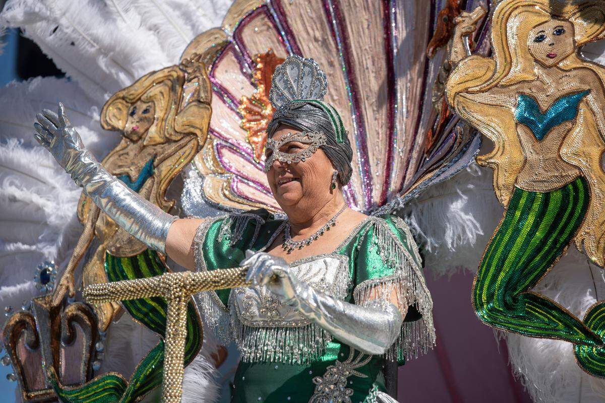 A member of the Krewe of Nereids court waves to the crowd during the Krewe of Nereids Mardi Gras parade on Highway 90 in Bay St. Louis on Sunday, Feb. 12, 2023.