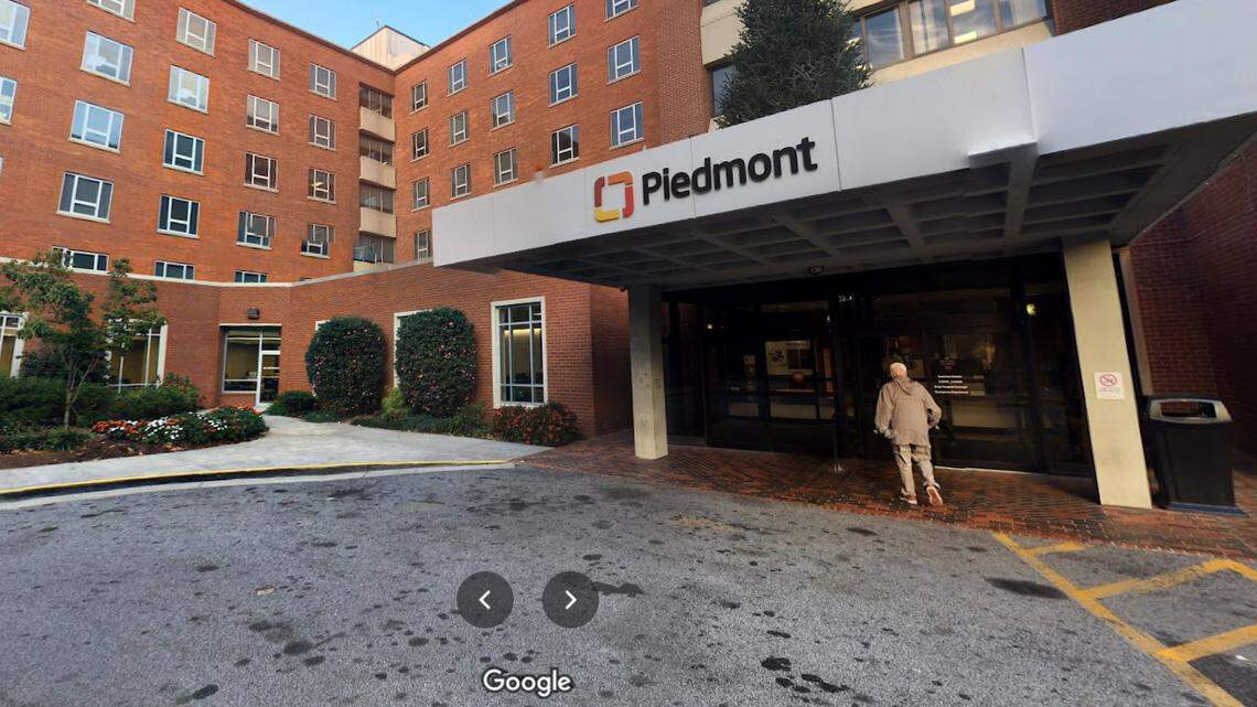 A woman pushed under a car during a fight inside a hospital parking garage at Piedmont Atlanta Hospital has died, police said.