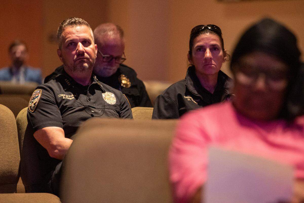 Gulfport police chief Adam Cooper, left, attends a coast-wide candlelight ceremony as a part of National Crime Victims’ Rights Week at First Baptist Church of Gulfport on Tuesday, April 29, 2025.