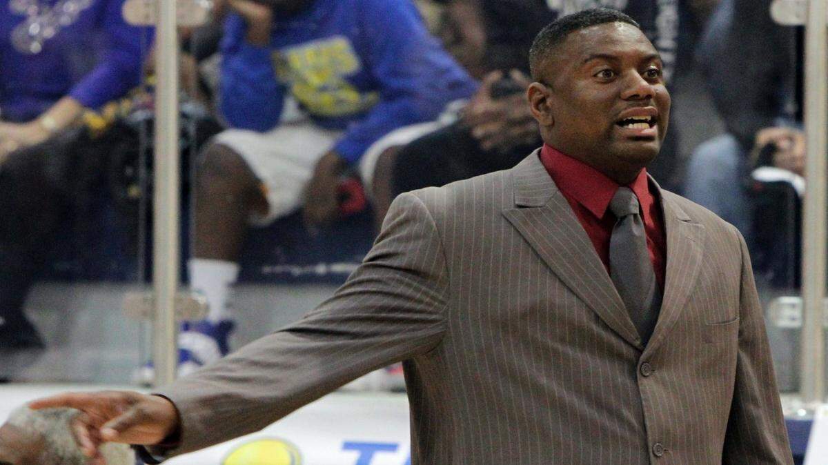JOHN FITZHUGH/SUN HERALD 
 Harrison Central head coach Boo Hardy gives instructions to his team during the second quarter of their 6A South State semifinal game against Biloxi at St. Martin High School on Friday Feb. 22, 2013.