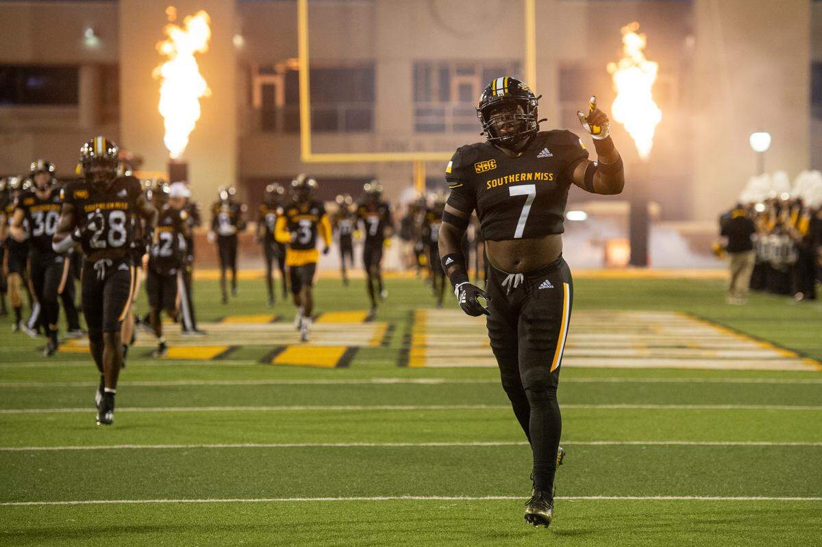 Southern Mississippi defensive lineman Dominic Quewon (7) runs onto the field before the first half of an NCAA college football game in Hattiesburg, Miss., Thursday, Oct. 27, 2022. (Hannah Ruhoff/The Sun Herald via AP)