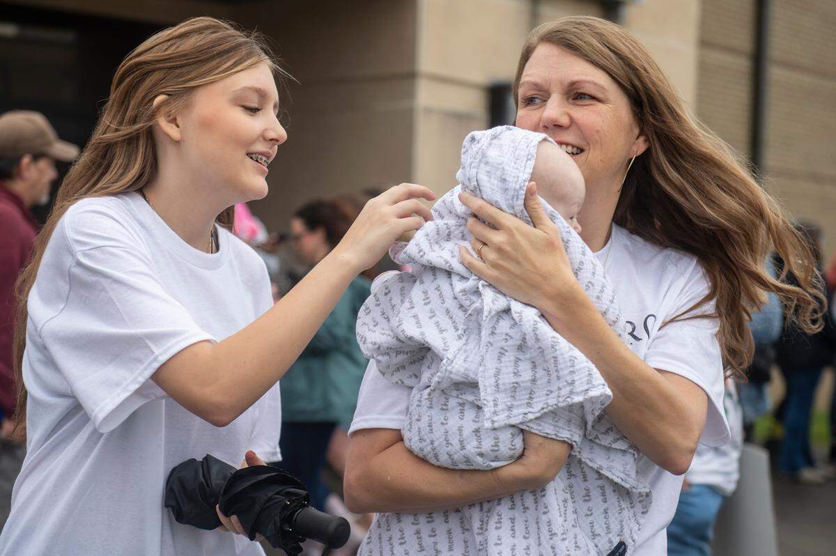 Heather Pinkston holds her newborn baby Elizabeth as she waits for her husband James, a member of Naval Mobile Construction Battalion 133, to return from deployment at a homecoming event at the Naval Construction Battalion Center in Gulfport on Tuesday, March 5, 2024. Pinkston’s newborn was born while James was deployed.