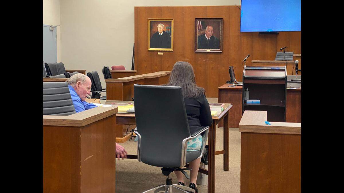 David Thomas Jordan speaks to one of his attorneys, Angela Broun, during his first-degree murder trial in Biloxi on Tuesday, Aug. 22, 2023.