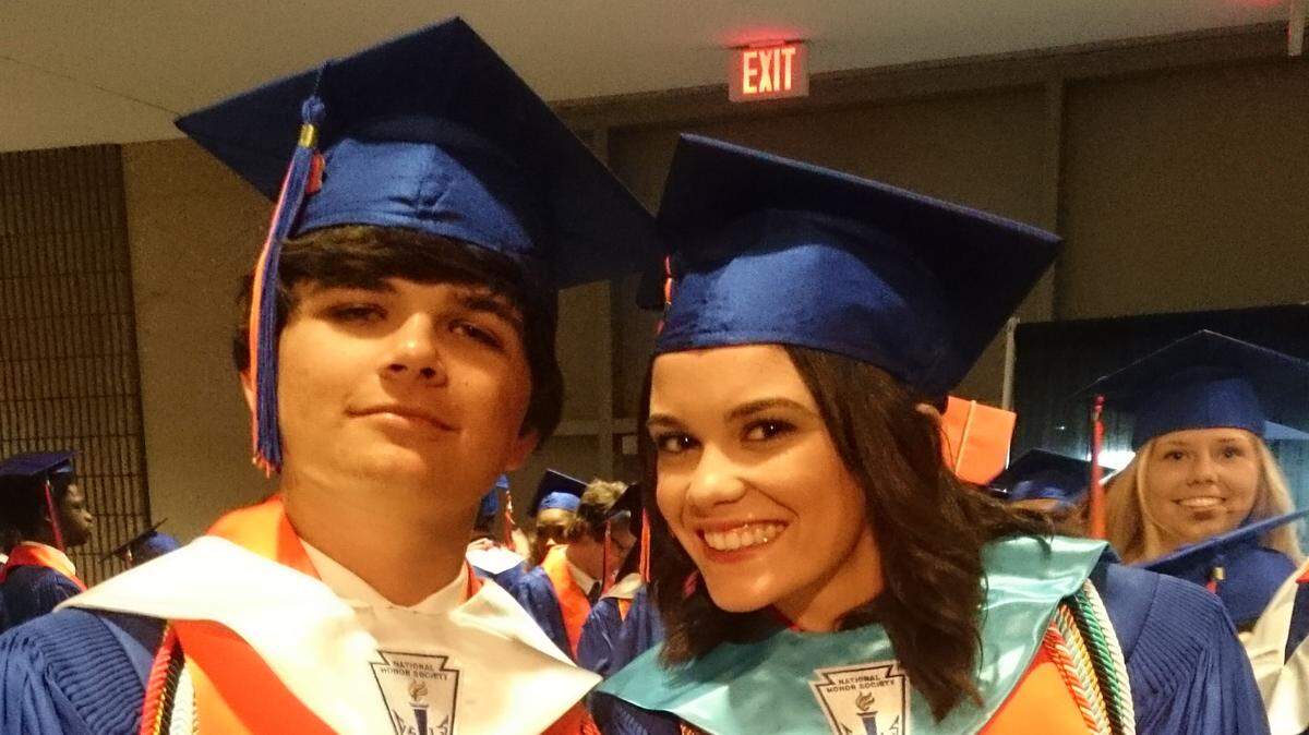 GORDON JACKSON/SPECIAL TO THE SUN HERALD 
 Valedictorian Chad Gutierrez, left, and salutatorian Julia Grant share a moment before their graduation ceremony Wednesday, May 25, 2016, at the Coast Coliseum in Biloxi.