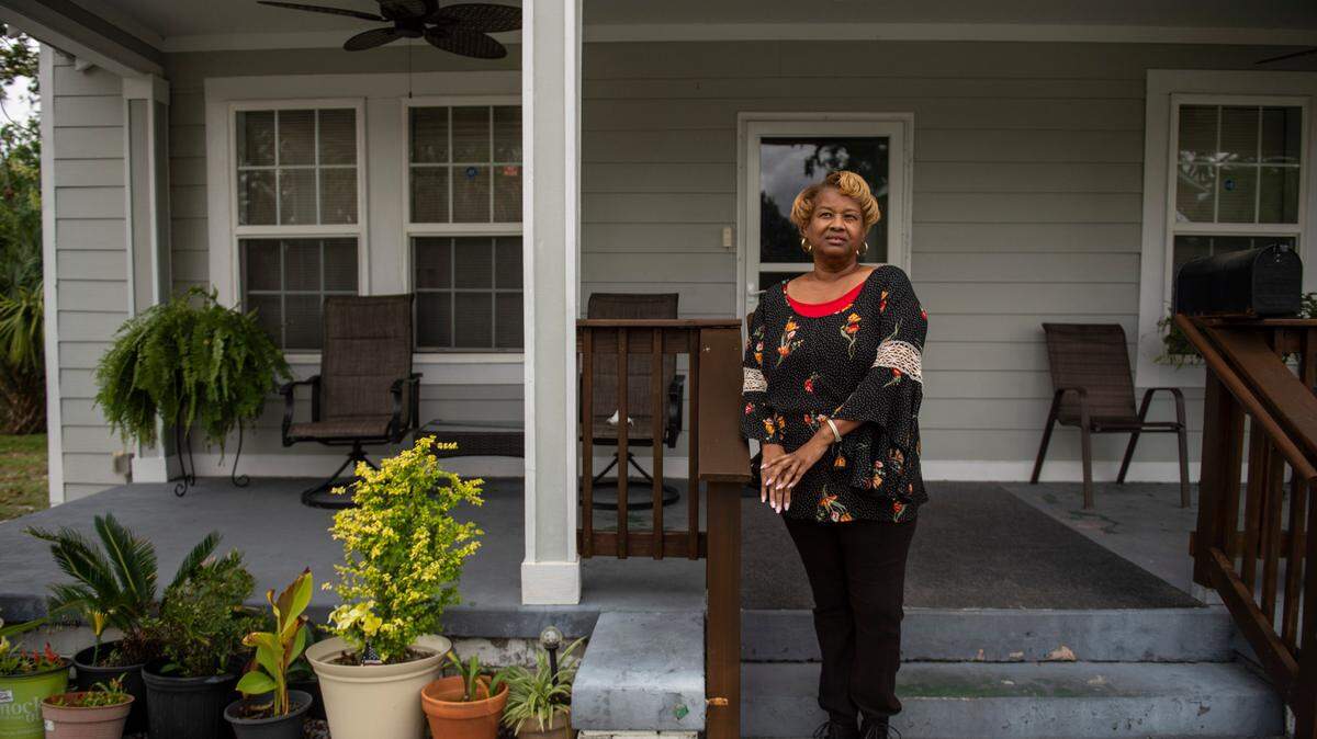 Karen Fleeton poses for a portrait outside her home in East Biloxi on Friday, Oct. 29, 2021.