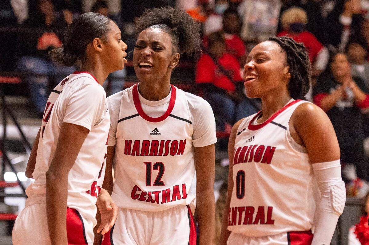 Harrison Central’s Hayleigh Breland, right, and Laila Walker, center, help up Anaisha Carriere after she was fouled by Gulfport during a game against Gulfport at Harrison Central High School in Gulfport on Friday, Feb. 4, 2022.