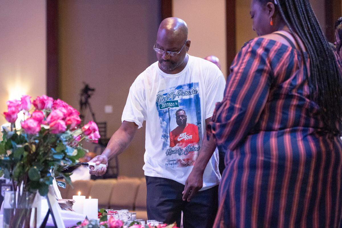 Family members of Randy Johnson light candles around a photo of him during a candlelight ceremony as a part of National Crime Victims’ Rights Week at First Baptist Church of Gulfport on Tuesday, April 23, 2024. Randy Johnson, 41, was shot and killed on Sept. 18, 2021 at the Golden Nugget Casino in Biloxi.
