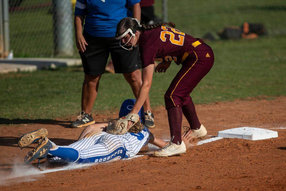 George County’s Natalie Jones tags out a Vancleave player as she slides back to third base during a game against Vancleave at Vancleave High School on Friday, May 6, 2022.