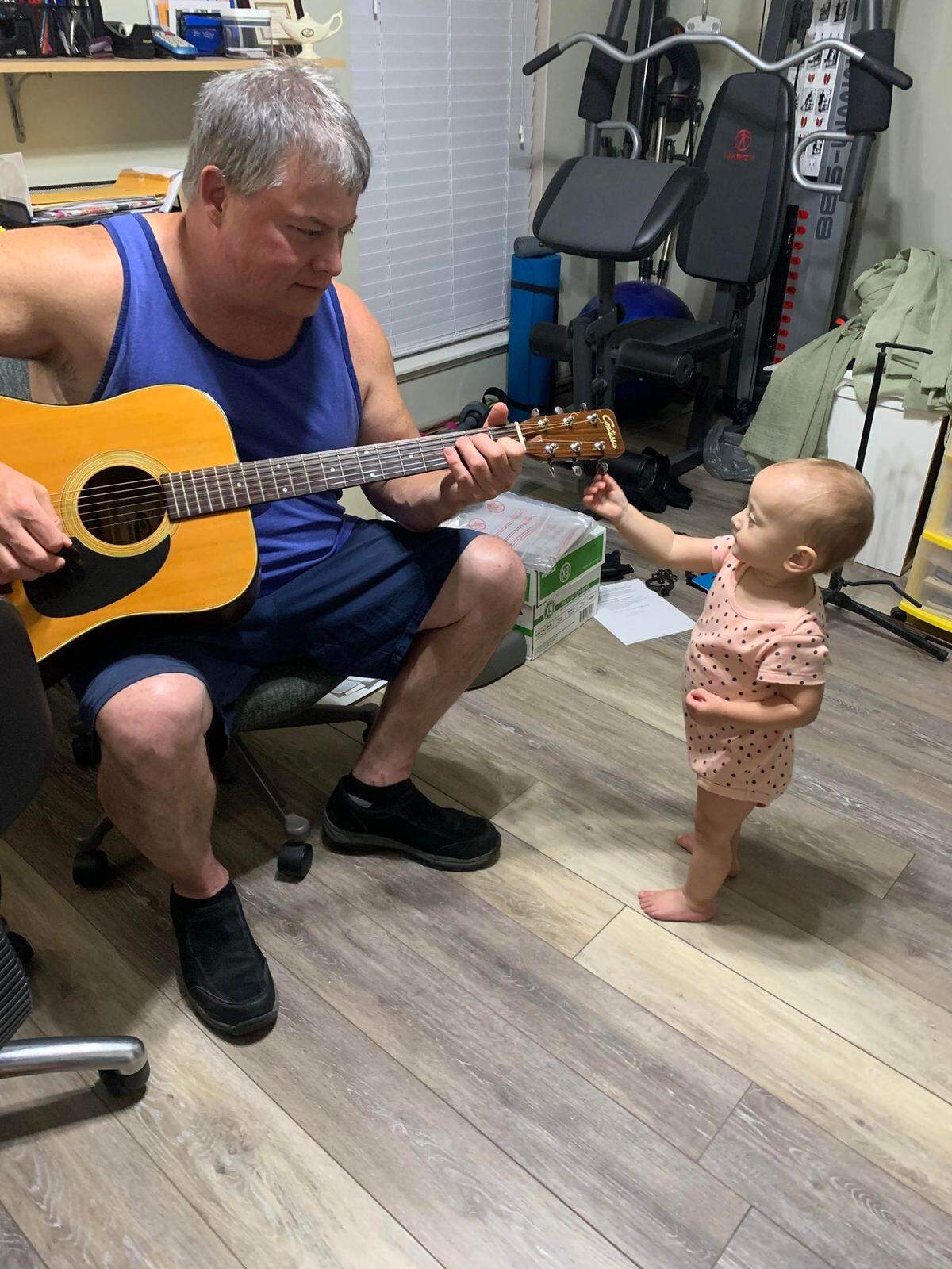 The Waltman family says they will miss their patriarch’s jam sessions. Pictured, Waltman and grandchild.