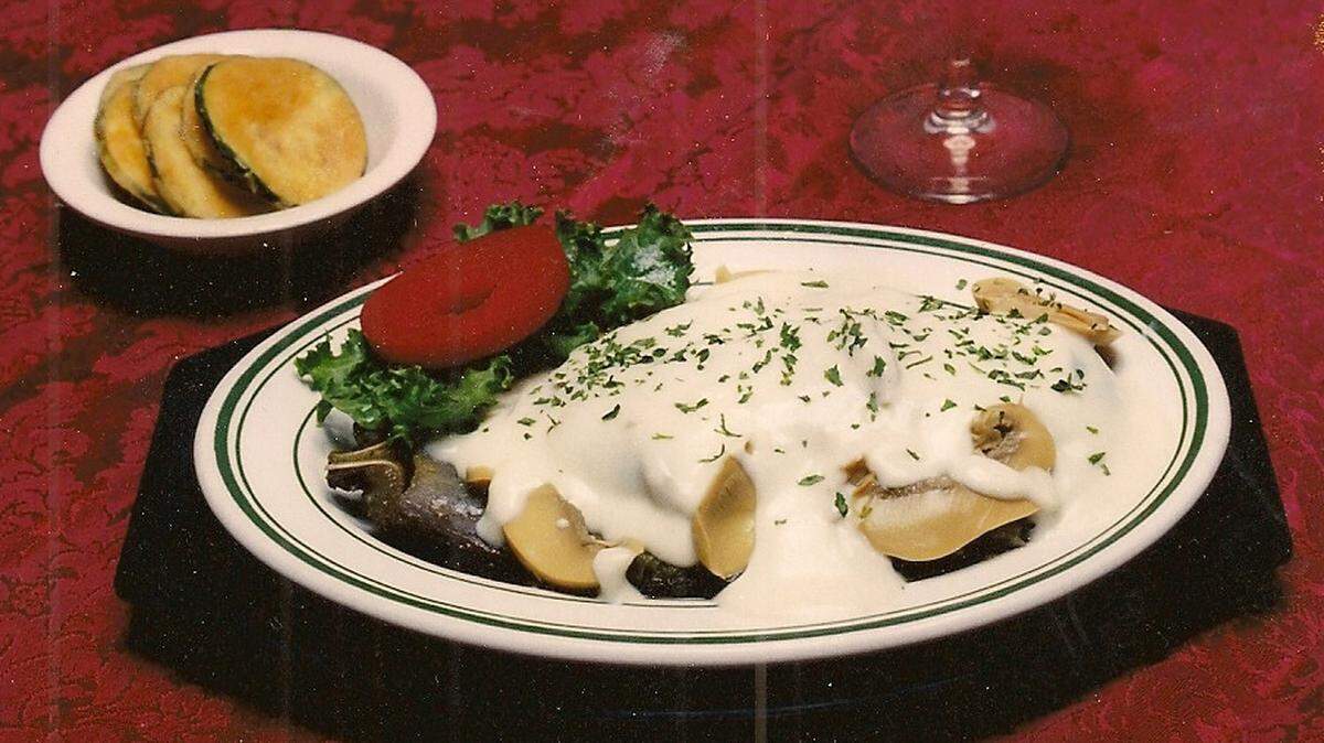 Eggpant Lamberto is stuffed with Italian bread seasoning, shrimp and topped with mushrooms and a white Mornay sauce.