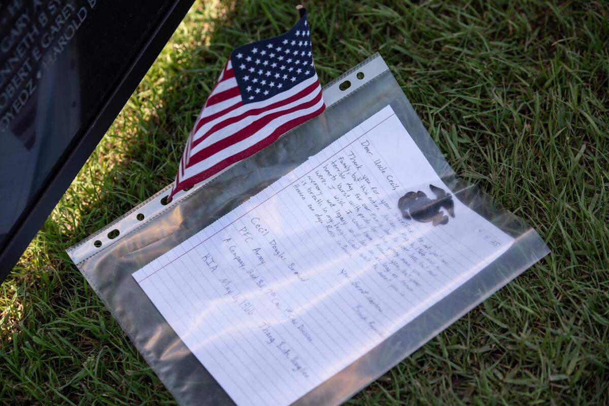 A letter from a family member to one of the men memorialized on The Wall That Heals, a traveling three-quarter scale replica of the Vietnam Veterans Memorial in D.C., while it is on display at the D’Iberville Sports Complex in D’Iberville on Thursday, April 10, 2025.