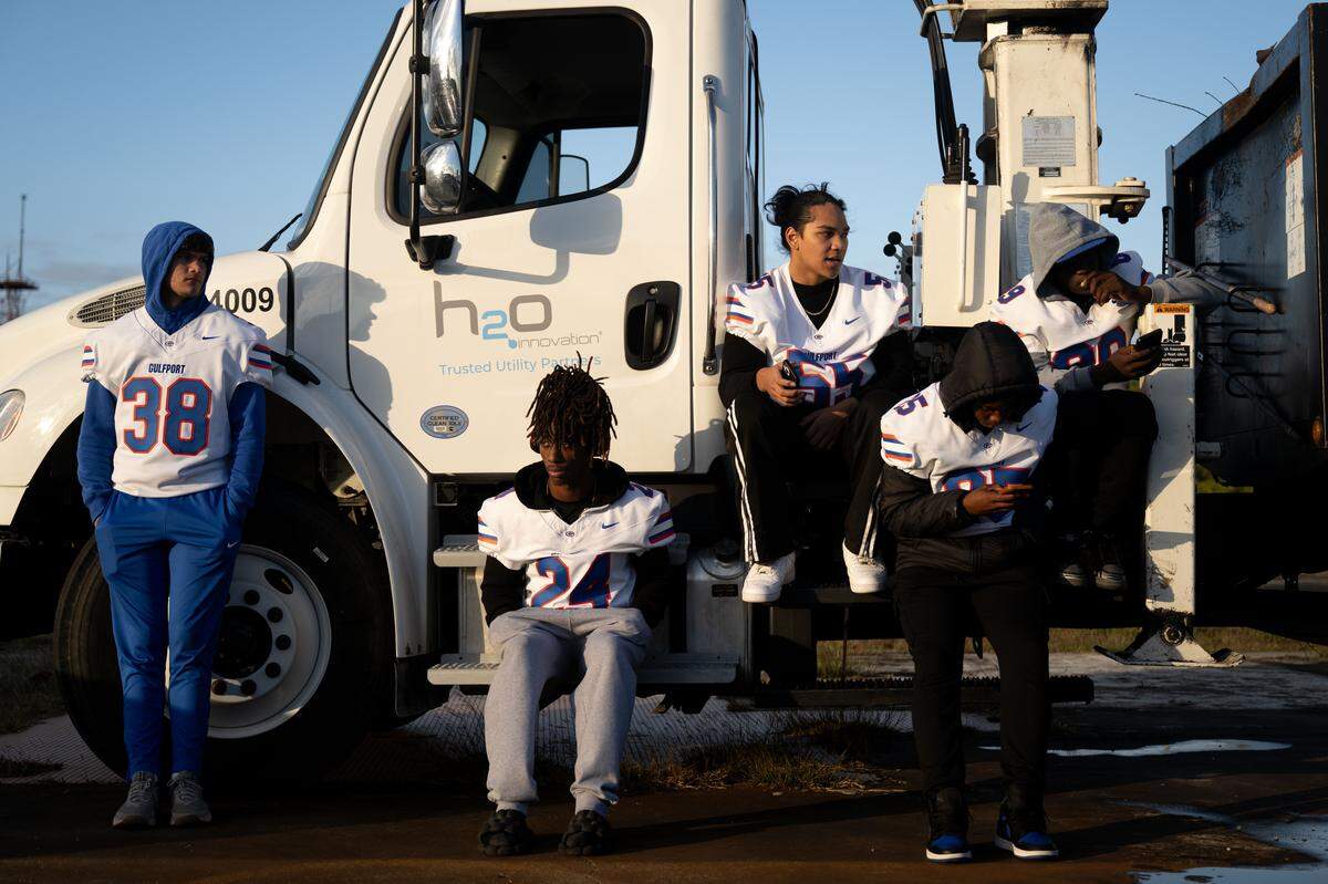 Gulfport players sit in front of a truck during the Champions Christmas Parade in Gulfport on Monday, Dec. 8, 2025.
