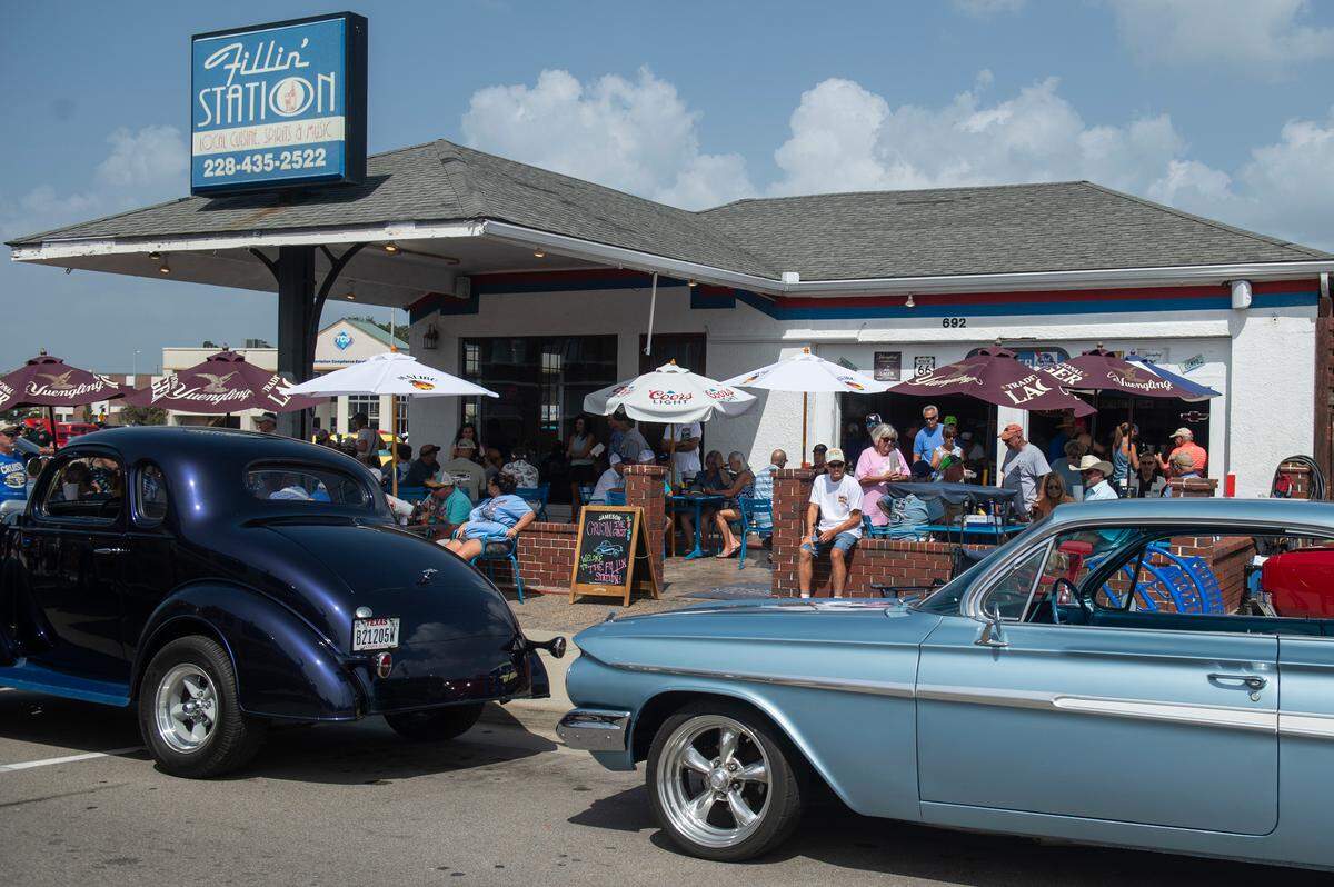 Classic cars are parked outside the Fillin’ Station restaurant during the Biloxi Block Party in 2023. Businesses are packed during the nine days of Cruisin’ that brings an economic impact of more than $36 million to South Mississippi each October.