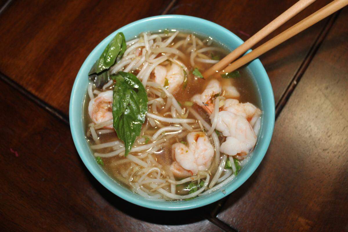 DT Hot Food & Grocery serves their pho with traditional toppings such as bean sprouts, basil, cilantro, lime wedges and chilies. Hoisin and sriracha sauce packets are offered on the side for additional flavor and heat.