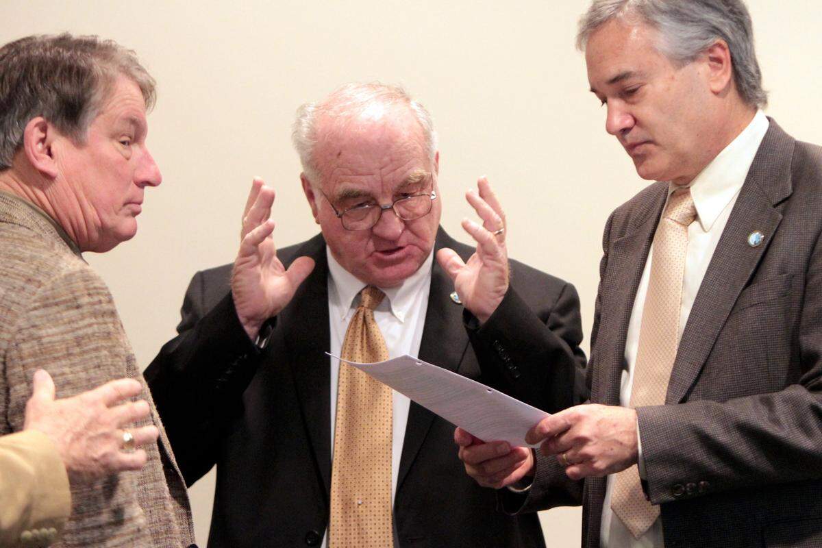 JOHN FITZHUGH/SUN HERALD Mississippi Commission on Marine Resources Commissioners Jimmy Taylor, from left, Richard Gollott and Vernon Asper talk during a break in their meeting at the Bolton building in Biloxi on Tuesday Feb. 19, 2013.