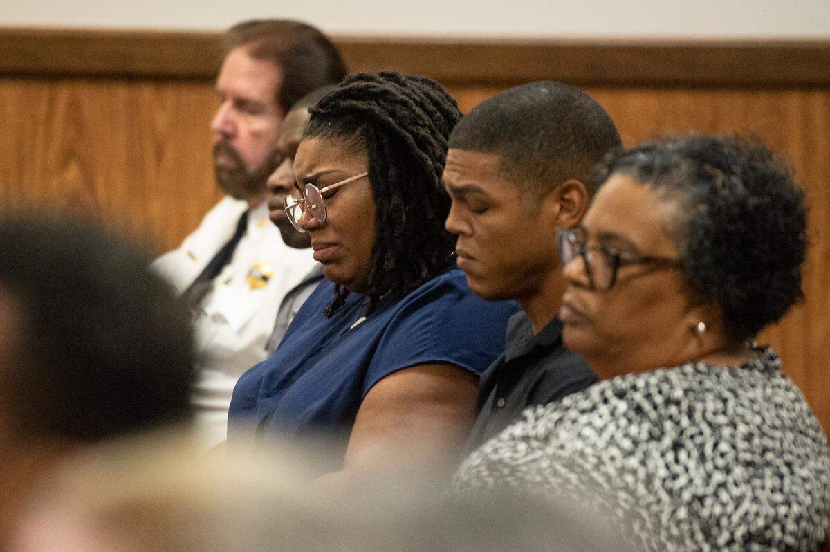 Jessica Boutte and Michael Boutte Jr. listen as Joseph Rohrbacker pleads guilty in the killing of Lt. Michael Boutte at Harrison County Circuit Court in Gulfport on Monday, July 31, 2023.