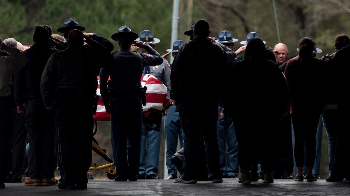 The body of Jeremy Malone, an officer with the George County Sheriff’s Office, is escorted into Moments Funeral Home in Lucedale on Friday, Jan. 5, 2024. Malone was killed on Thursday when conducting a traffic stop near a Dollar General.