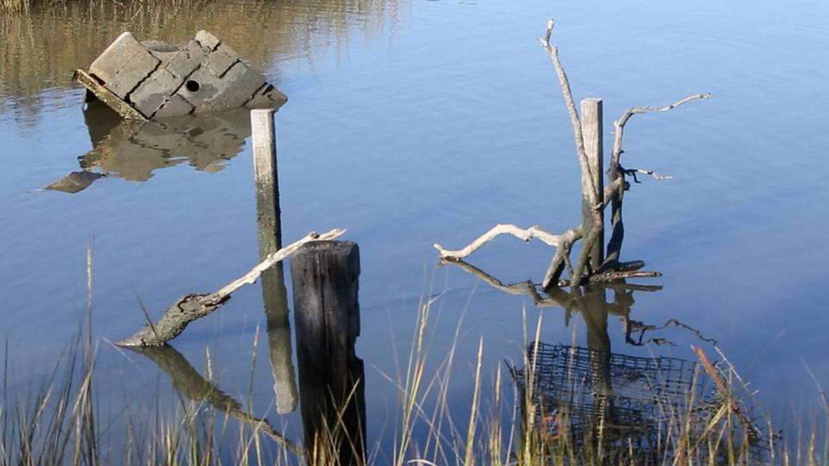 JOHN FITZHUGH/SUN HERALD/FILEDebris has clogged Clermont Harbor in Hancock County since before Hurricane Katrina in 2005. A program called Renew Our Rivers worked to clean up the harbor Oct. 14 and in the spring will begin the second of three planned cleanup phases.