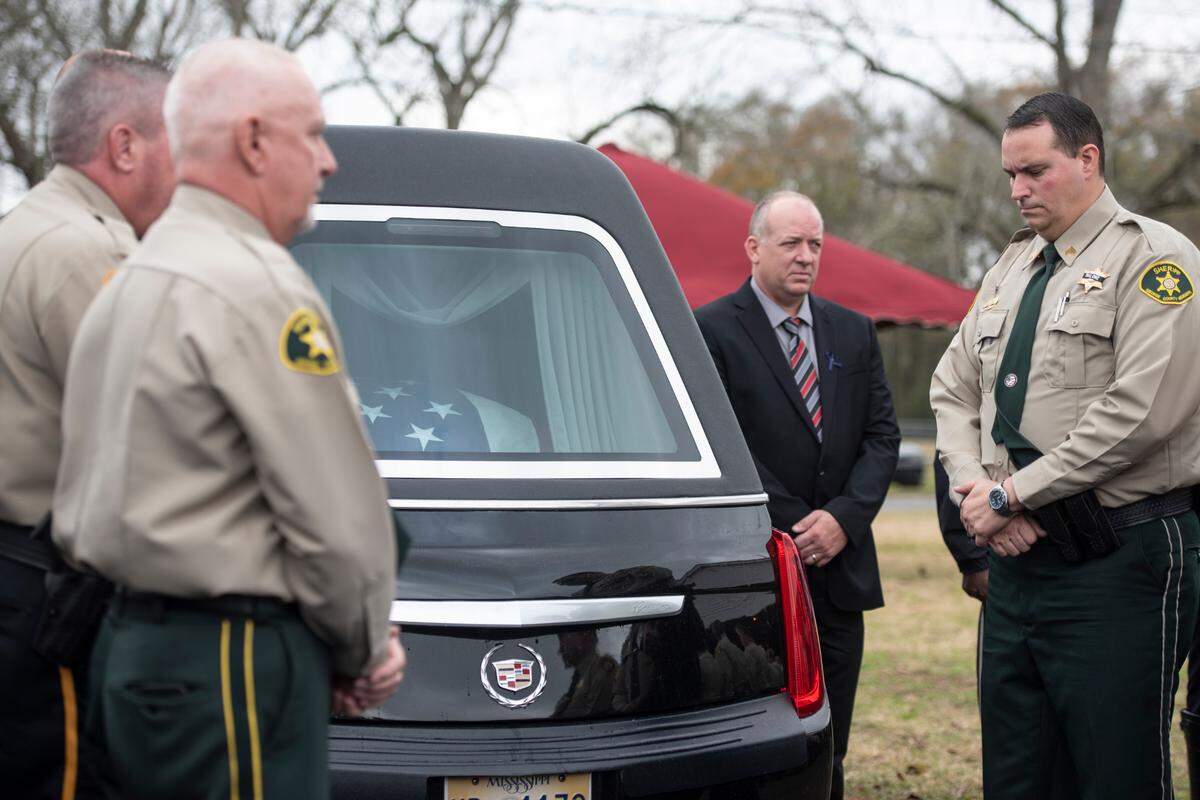 The casket of George County Sheriff’s Deputy Jeremy Malone is seen in the hearse following Malone’s funeral at Agricola Baptist Church in George County on Friday, Jan. 12, 2024.