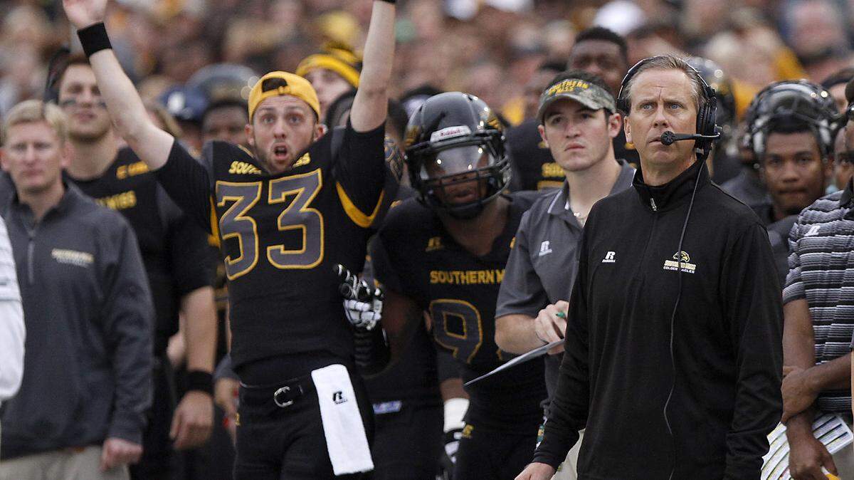 TIM ISBELL/SUN HERALD 
 Southern Miss punter Matthew Moseley signals touchdown as Todd Monken watches for an instant replay on Nov. 21 in Hattiesburg.