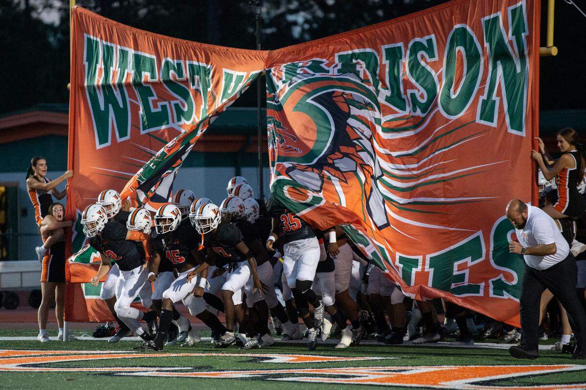 The West Harrison Hurricanes football team takes the field for a game against Moss Point at West Harrison High School in Gulfport on Friday, Sept. 22, 2023.