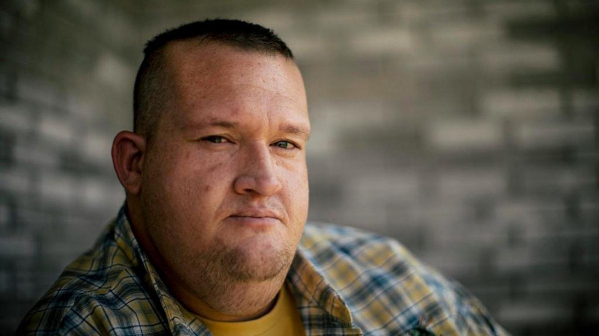 In this Aug. 22, 2017, photo, Brandon Spurgin sits at home of his mother Reese in Velma, Okla. Spurgin was struggling with a meth addiction when the Stephens County drug court sent him to Christian Alcoholics & Addicts in Recovery, also known as CAAIR, in 2014.
